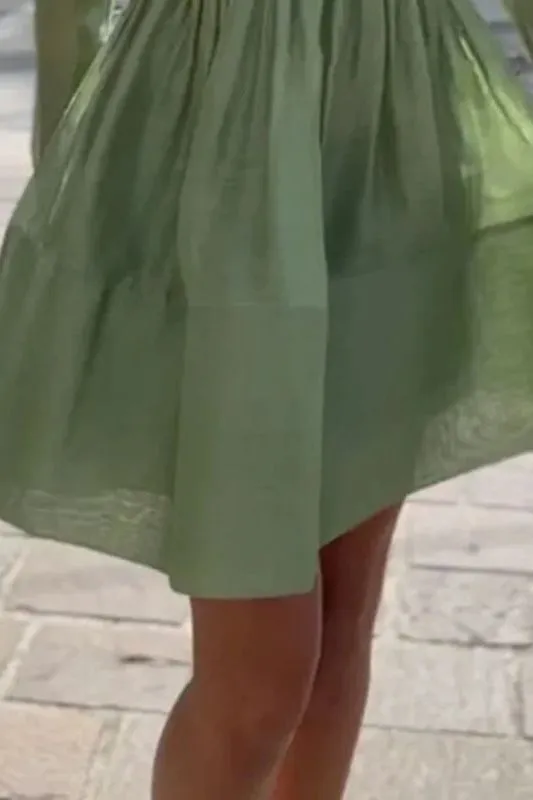 Mint green pleated cake dress